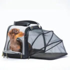 Transportadora transpirable expandible para mascotas con lateral retráctil