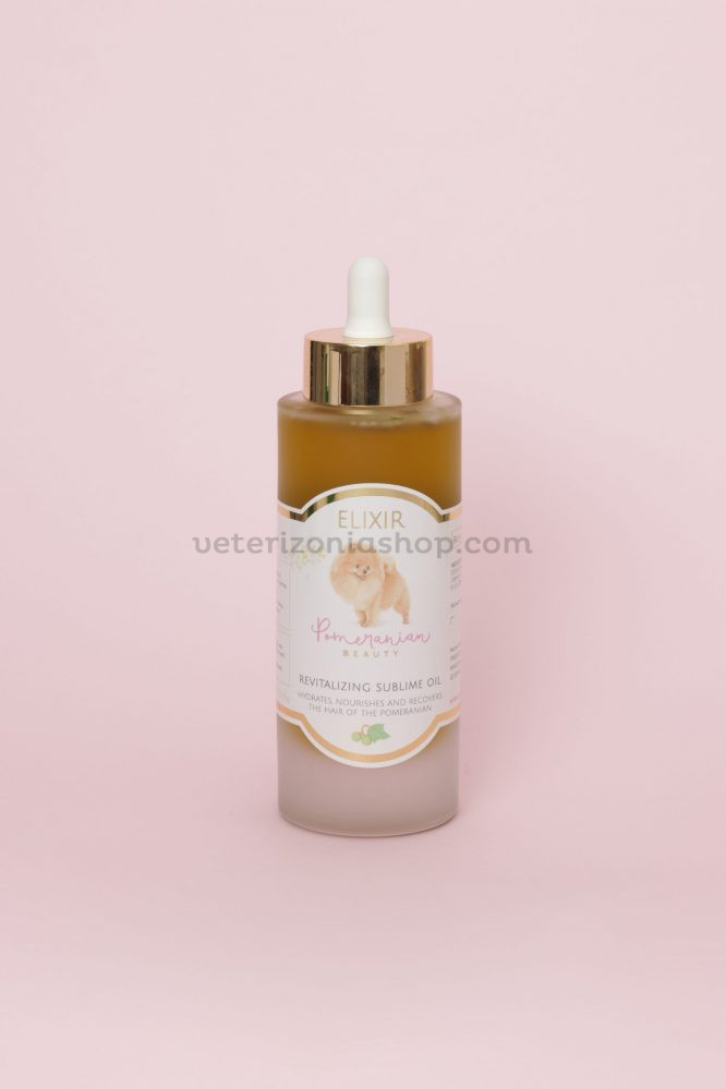 Aceite Elixir Pomeranian Beauty 100 ml Frasco de aceite Elixir Pomeranian Beauty de 100 ml sobre fondo rosa