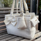 Bolso transportín Bouclé City en color claro con asas y lazo